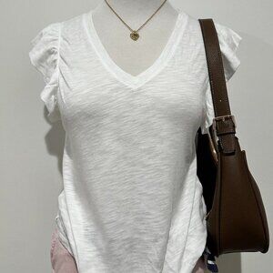 White V-neck blouse with ruffled sleeves